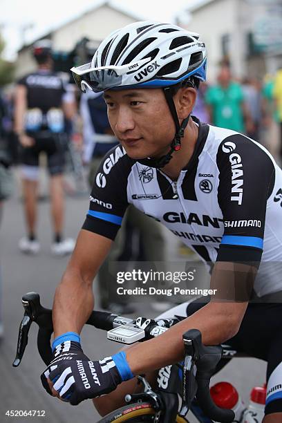 Ji Cheng of China and Team Giant-Shimano prepares for the start of stage eight of the 2014 Le Tour de France from Tomblaine to Gerardmer La...