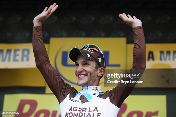 Stage winner Blel Kadri of France and AG2R La Mondiale celebrates on the podium after winning the eighth stage of the 2014 Tour de France, a 161km...