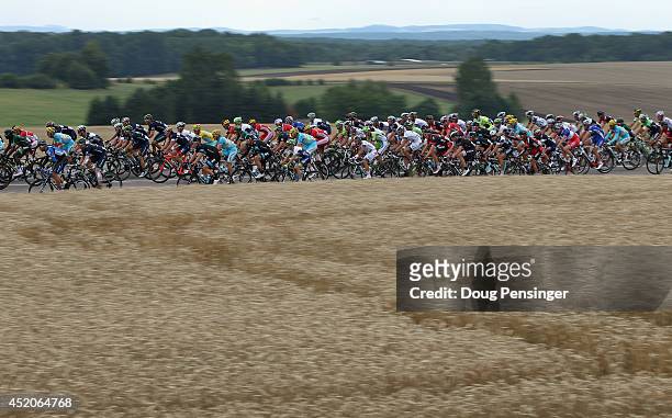 The peloton sets a fast pace at the begining of stage eight of the 2014 Le Tour de France from Tomblaine to Gerardmer La Mauselaine on July 12, 2014...