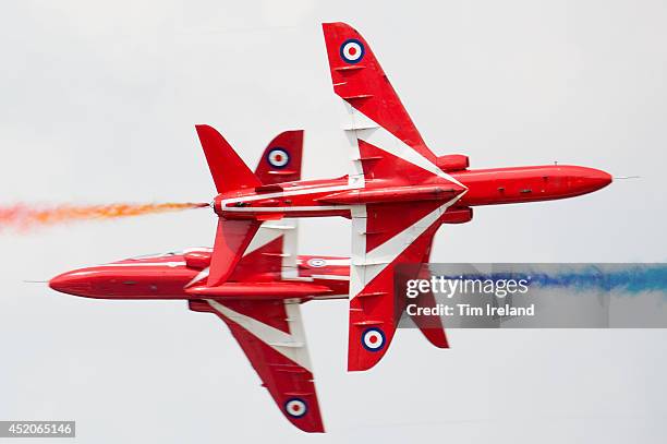 The Red Arrows perform as part of the celebrations for the their 50th display season during the Royal International Air Tattoo at RAF Fairford on...