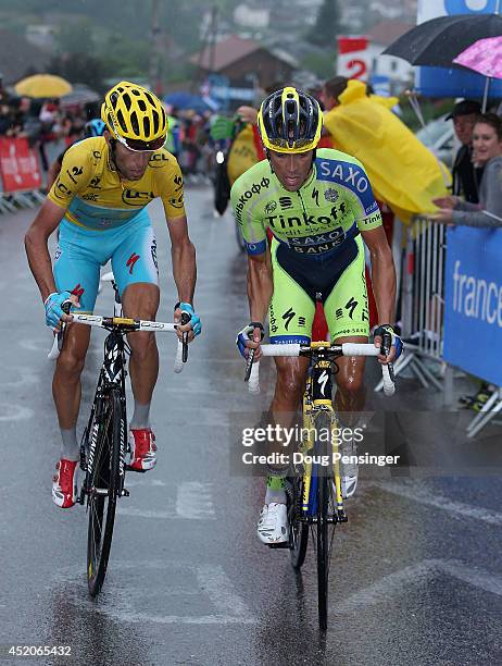 Alberto Contador of Spain and Tinkoff-Saxo attacks Vincenzo Nibali of Italy and the Astana Pro Team in the overall race leader's yellow jersey on the...