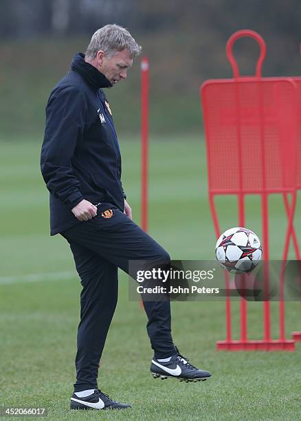 Manager David Moyes of Manchester United in action during a first team training session, ahead of their UEFA Champions League Group A match against...