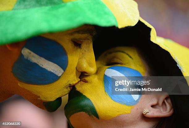 Brazil fans kiss prior to the 2014 FIFA World Cup Brazil Third Place Playoff match between Brazil and the Netherlands at Estadio Nacional on July 12,...