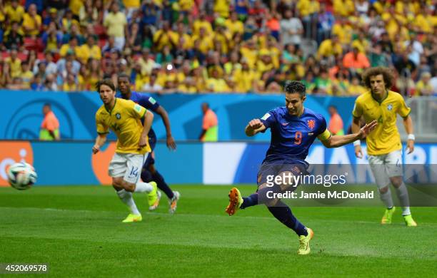Robin van Persie of the Netherlands shoots and scores his team's first goal on a penalty kick during the 2014 FIFA World Cup Brazil Third Place...