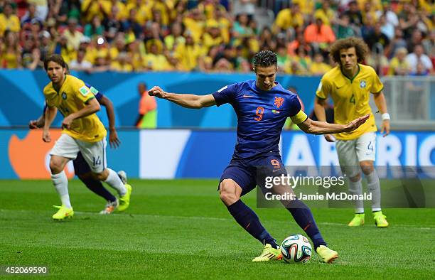 Robin van Persie of the Netherlands shoots and scores his team's first goal on a penalty kick during the 2014 FIFA World Cup Brazil Third Place...