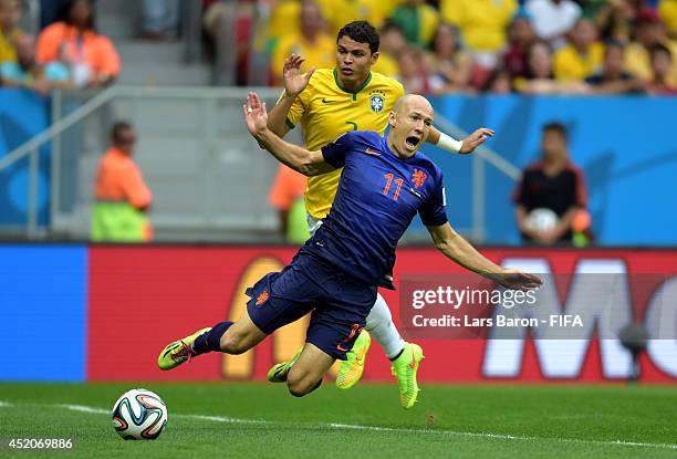 Arjen Robben of the Netherlands is brought down by Thiago Silva of Brazil in the penalty box before awarded a penalty kick during the 2014 FIFA World...