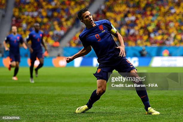 Robin van Persie of the Netherlands celebrates scoring his team's first goal from the penalty spot during the 2014 FIFA World Cup Brazil 3rd Place...