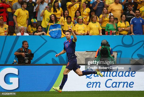 Robin van Persie of the Netherlands celebrates scoring his team's first goal on a penalty kick during the 2014 FIFA World Cup Brazil Third Place...