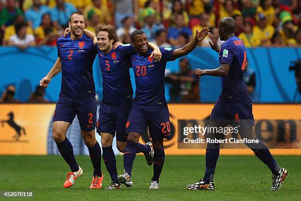 Daley Blind of the Netherlands celebrates scoring his team's second goal with Ron Vlaar , Georginio Wijnaldum and Bruno Martins Indi during the 2014...