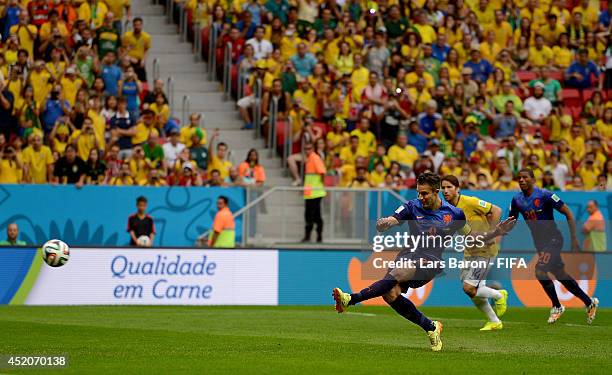 Robin van Persie of the Netherlands scores his team's first goal from the penalty spot during the 2014 FIFA World Cup Brazil 3rd Place Playoff match...