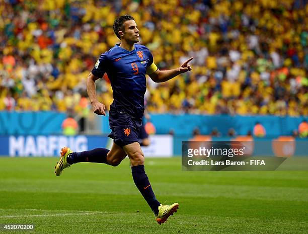 Robin van Persie of the Netherlands celebrates scoring his team's first goal from the penalty spot during the 2014 FIFA World Cup Brazil 3rd Place...