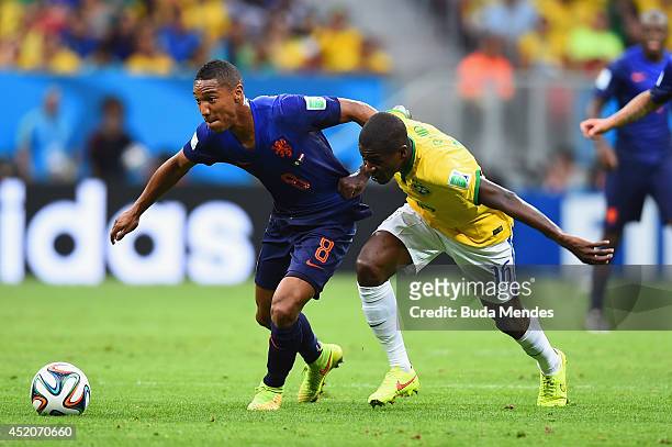 Ramires of Brazil challenges Jonathan de Guzman of the Netherlands during the 2014 FIFA World Cup Brazil Third Place Playoff match between Brazil and...