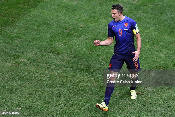 Robin van Persie of the Netherlands celebrates scoring his team's first goal on a penalty kick during the 2014 FIFA World Cup Brazil Third Place...