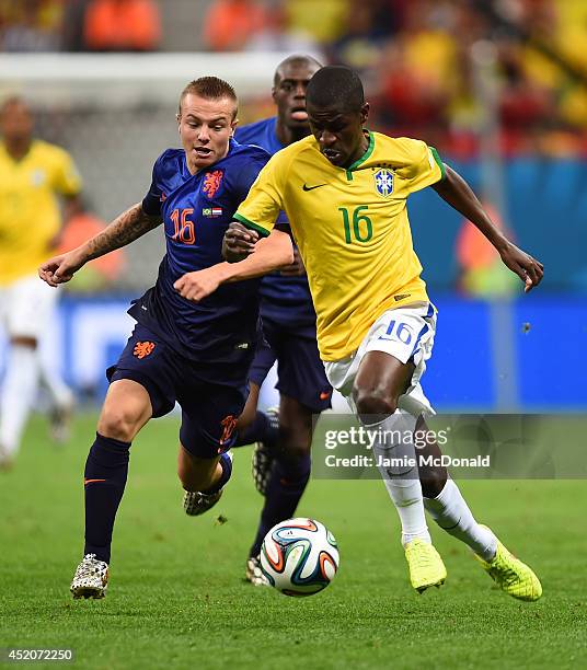 Jordy Clasie of the Netherlands and Ramires of Brazil compete for the ball during the 2014 FIFA World Cup Brazil Third Place Playoff match between...