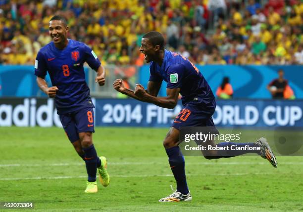 Georginio Wijnaldum of the Netherlands celebrates scoring his team's third goal with Jonathan de Guzman during the 2014 FIFA World Cup Brazil Third...
