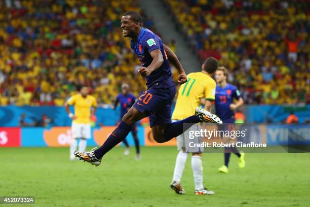 Georginio Wijnaldum of the Netherlands celebrates scoring his team's third goal during the 2014 FIFA World Cup Brazil Third Place Playoff match...