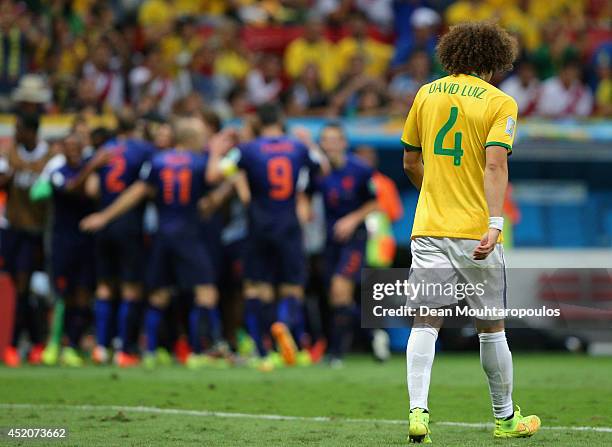 Dejected David Luiz of Brazil walks off the pitch after a 3-0 defeat to the Netherlands during the 2014 FIFA World Cup Brazil Third Place Playoff...