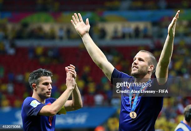 Ron Vlaar and Robin van Persie of the Netherlands celebrate after the 2014 FIFA World Cup Brazil 3rd Place Playoff match between Brazil and...