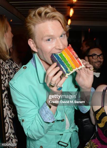 Henry Conway eats cake as he celebrates his birthday at Pont St Restaurant in the Belgraves Hotel on July 12, 2014 in London, England.