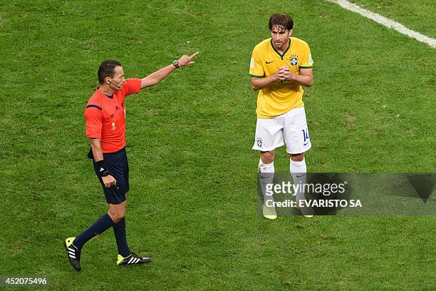 Brazil's defender Maxwell gestures towards Algerian referee Djamel Haimoudi during the third place play-off football match between Brazil and...