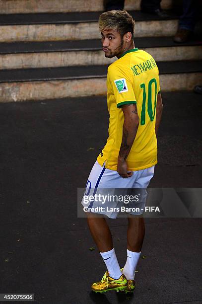 Injured Neymar of Brazil walks off the pitch after the 2014 FIFA World Cup Brazil 3rd Place Playoff match between Brazil and Netherlands at Estadio...