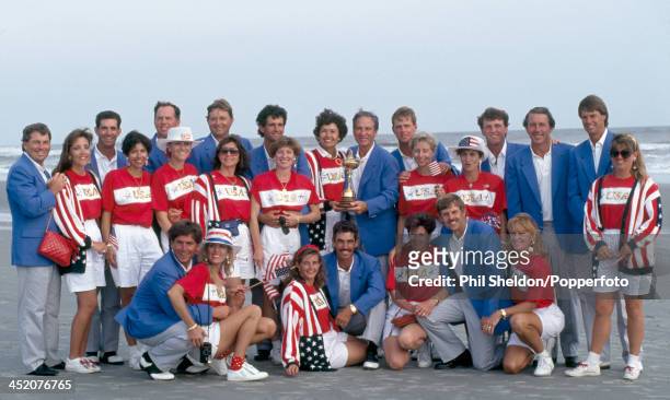 The United States team with their wives and the trophy after winning the Ryder Cup golf competition held at the Kiawah Island Golf Resort, South...