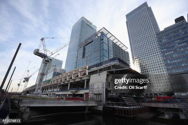 Builders continue the construction of the Canary Wharf Crossrail station and retail development in the North Dock of the Isle of Dogs on November 26,...