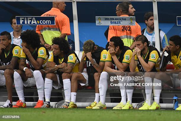 Brazil's midfielder Luiz Gustavo, Brazil's defender Dante, Brazil's defender Marcelo, Brazil's injured forward Neymar, Brazil's forward Fred,...