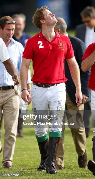 Prince Harry walks to the presentation after playing in the Army v ...