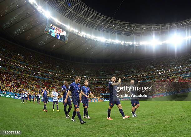 The Netherlands national football team players celebrate after defeating Brazil 3-0 during the 2014 FIFA World Cup Brazil Third Place Playoff match...