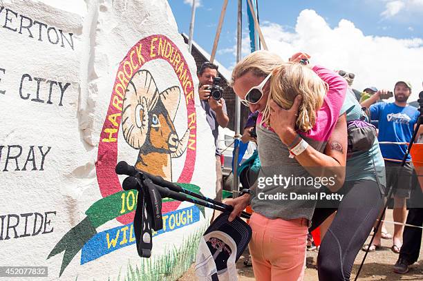 Darcy Piceu Africa hugs her daughter, Sophia, after finishing the 100.5-mile Hardrock 100 Endurance Run on July 12 in the San Juan Mountains in...