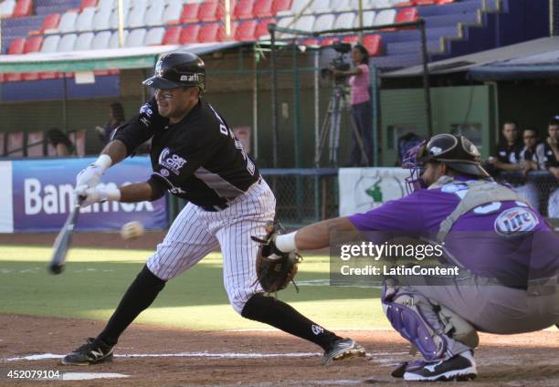 Oscar Robles of Guerreros tries to hit a pitched ball during a match between Delfines del Carmen and Guerreros de Oaxaca as part of the Mexican...