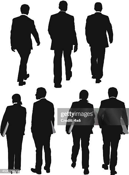 multiple silhouettes of business people - hands in pockets vector stock illustrations