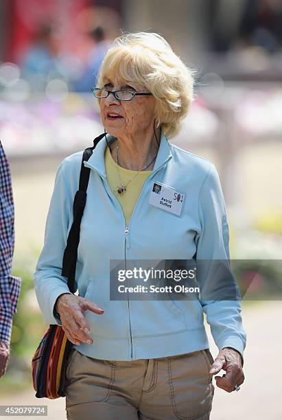 Astrid Buffet walks with her husband Warren Buffett, chairman of Berkshire Hathaway Inc., at the Allen & Company Sun Valley Conference at the Sun...