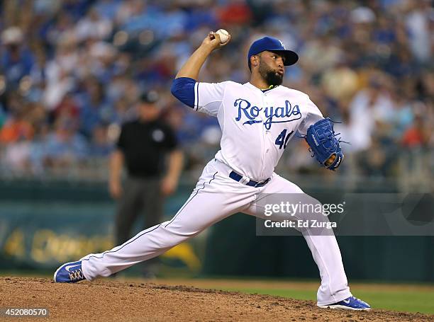 Kelvin Herrera of the Kansas City Royals throws in the eighth inning against the Detroit Tigers at Kauffman Stadium on July 12, 2014 at Kauffman...