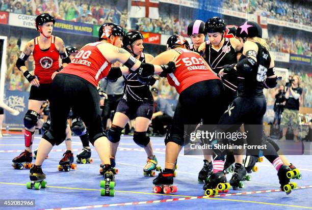 Ana Bollocks and Mick Swagger of Gotham Girls Roller Derby All Stars and Stefanie Mainey and Lexi Lightspeed of London Rollergirls during the London...