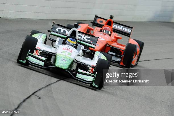 Sebastien Bourdais of France, driver of the Mistic KVSH Racing Dallara Chevrolet, races during the Iowa Corn Indy 300 at Iowa Speedway on July 12,...