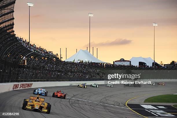 Ryan Hunter-Reay, driver of the DHL Andretti HVM Dallara Honda, leads a pack of cars during the Iowa Corn Indy 300 at Iowa Speedway on July 12, 2014...