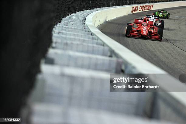 Tony Kanaan of Brazil, driver of the Target Chip Ganassi Racing Dallara Chevrolet, races during the Iowa Corn Indy 300 at Iowa Speedway on July 12,...