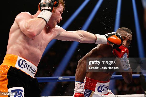 Canelo Alvarez lands a left jab to the head of Erislandy Lara during their junior middleweight bout at the MGM Grand Garden Arena on July 12, 2014 in...