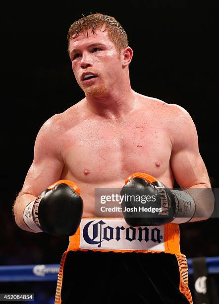 Canelo Alvarez battles Erislandy Lara during their junior middleweight bout at the MGM Grand Garden Arena on July 12, 2014 in Las Vegas, Nevada....