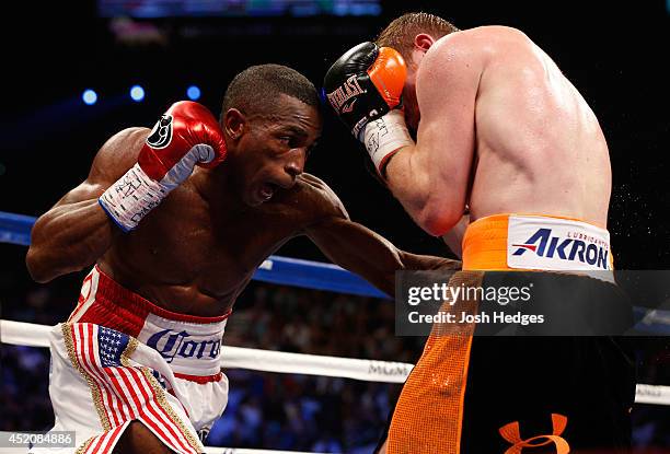 Erislandy Lara lands a left to the body of Canelo Alvarez during their junior middleweight bout at the MGM Grand Garden Arena on July 12, 2014 in Las...