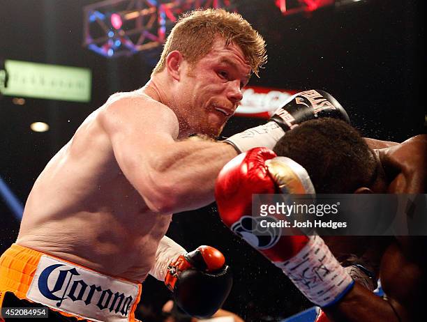 Canelo Alvarez lands a right to the head of Erislandy Lara during their junior middleweight bout at the MGM Grand Garden Arena on July 12, 2014 in...