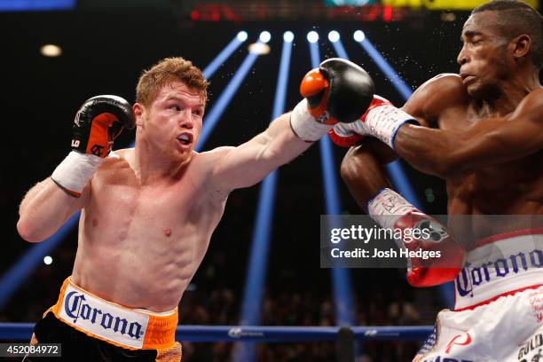 Canelo Alvarez lands a left to the head of Erislandy Lara during their junior middleweight bout at the MGM Grand Garden Arena on July 12, 2014 in Las...