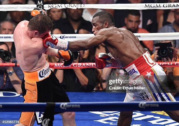 Erislandy Lara hits Canelo Alvarez in the 10th round of their junior middleweight bout at the MGM Grand Garden Arena on July 12, 2014 in Las Vegas,...