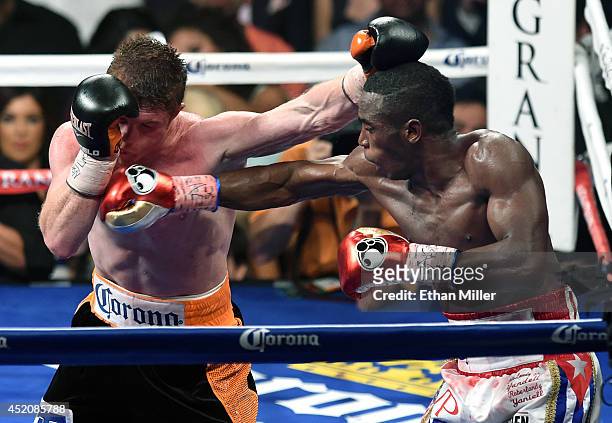 Canelo Alvarez and Erislandy Lara battle in the 10th round of their junior middleweight bout at the MGM Grand Garden Arena on July 12, 2014 in Las...