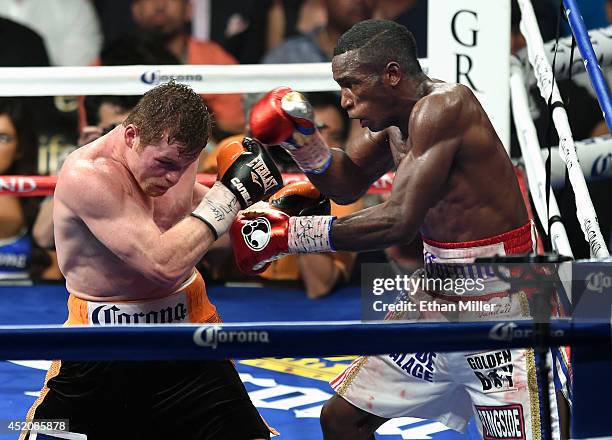 Canelo Alvarez and Erislandy Lara battle in the 11th round of their junior middleweight bout at the MGM Grand Garden Arena on July 12, 2014 in Las...