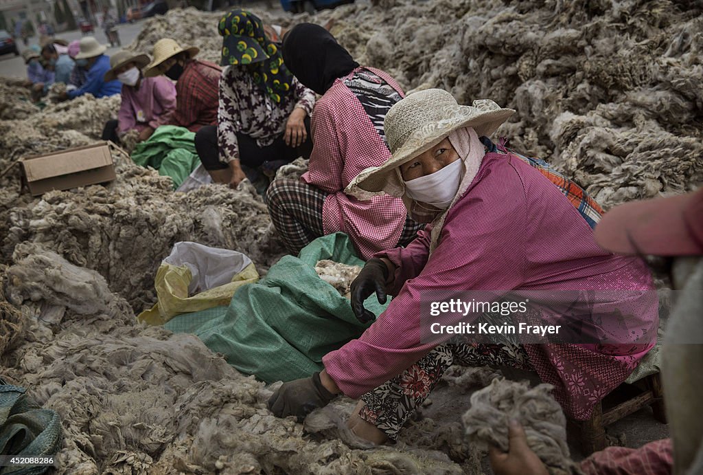 Chinese Workers Prepare Australian Sheep's Wool For Fashion Industry