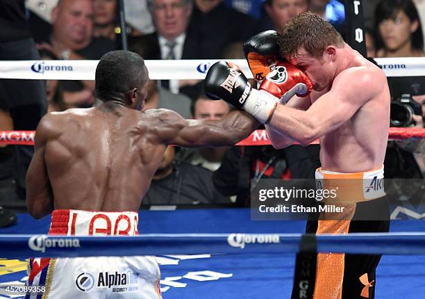 Erislandy Lara hits Canelo Alvarez in the seventh round of their junior middleweight bout at the MGM Grand Garden Arena on July 12, 2014 in Las...