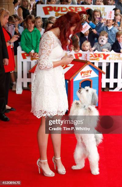 Ashleigh Bulter and Pudsey attend the World Premiere of "Pudsey The Dog: The Movie" at Vue West End on July 13, 2014 in London, England.